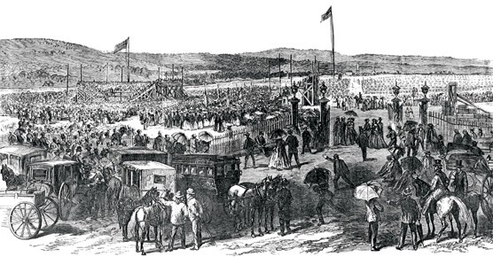 An engraving of a large crowd of men, women, horses, and carriages at the cemetery grounds.