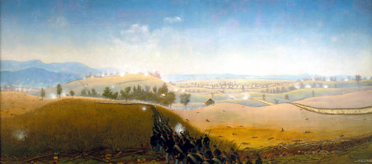 soldiers attack across a field