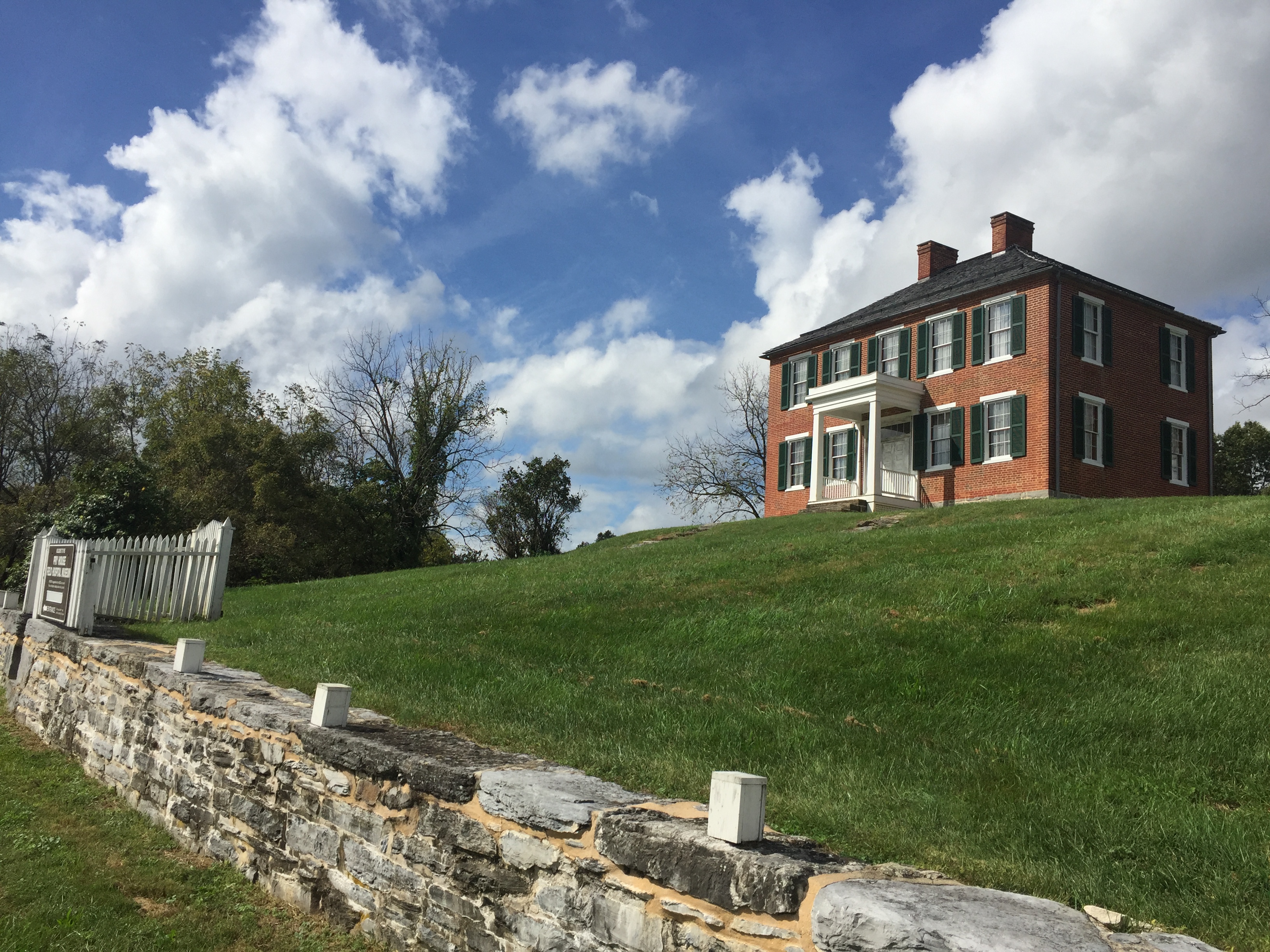 red brick house on hill