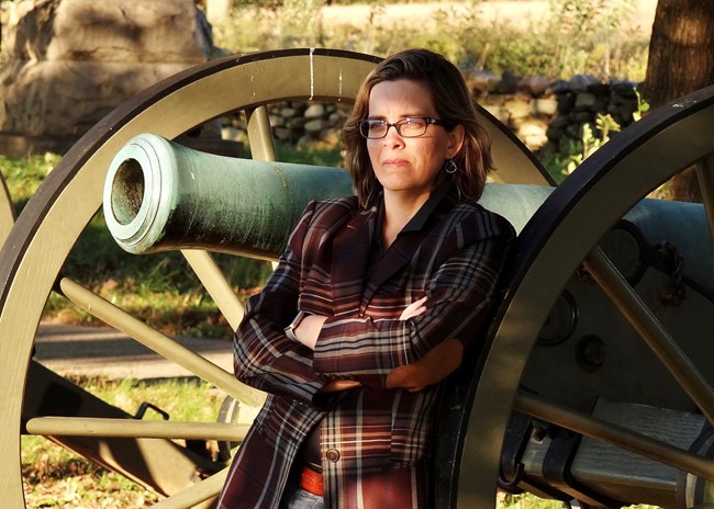 person standing by cannon