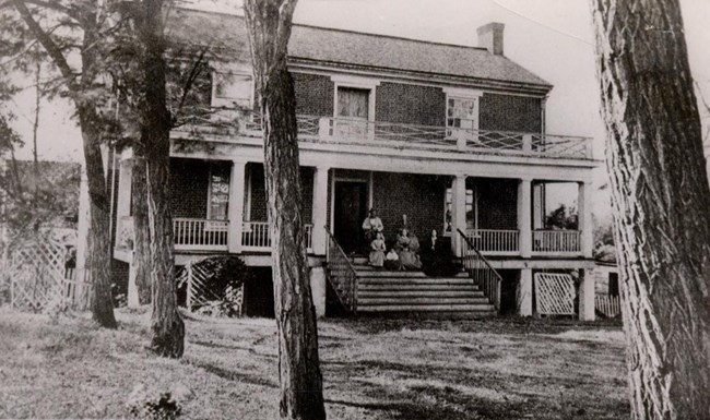 Picture of the McLean family sitting in front of the McLean House