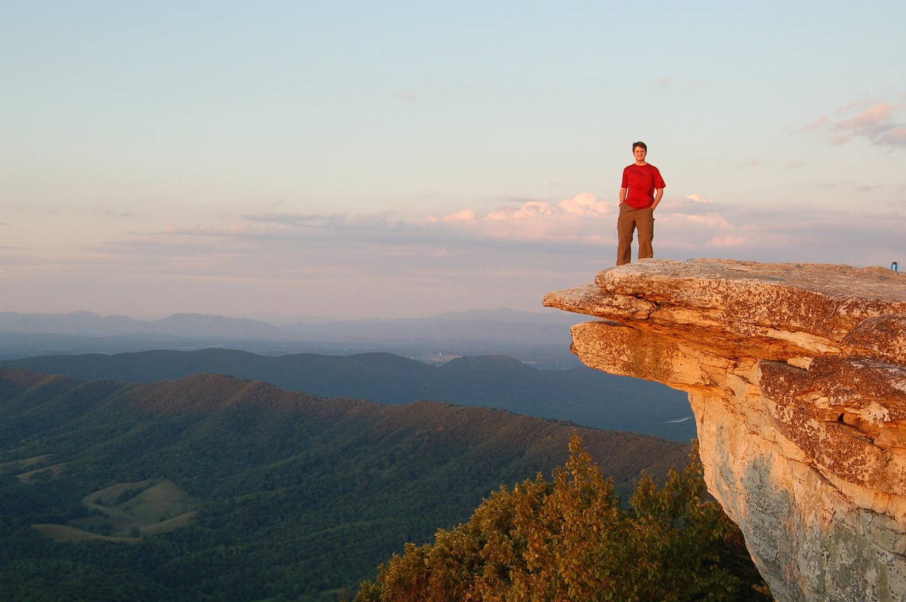 The iconic Dragon's Tooth, a craggy mountain overhang with a stunning view.