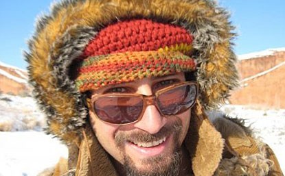 Close-up of a smiling man in a winter outfit.