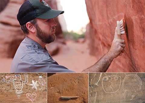 A male ranger uses a brush to remove graffiti drawing on the rock wall. Below are three images of examples of graffiti scratched into the rock- a robot, heart, star, ladybug, names, and face.