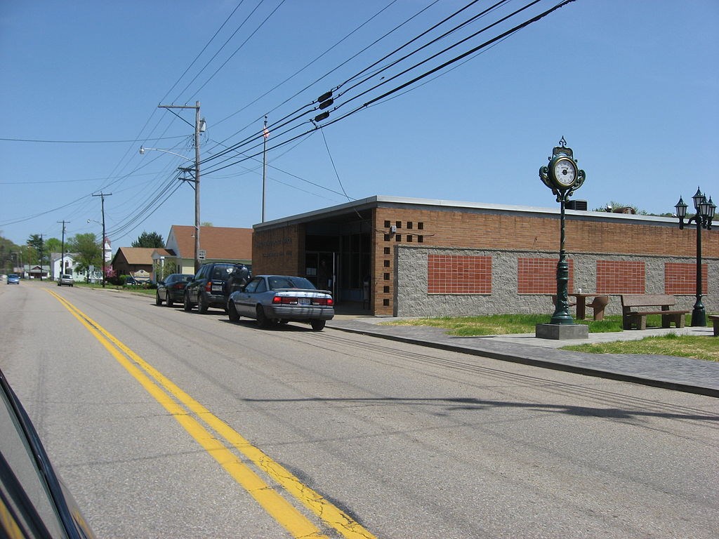 Street running in front of the brown masonry New Matamoras Post Office