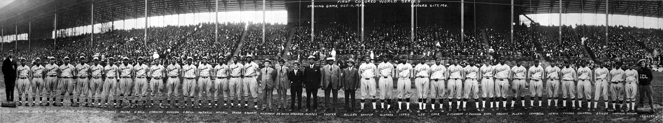 The two opposing teams  line up at the 1924 Colored World Series. The Kansas City Monarchs of the Negro National League took on the Eastern Colored League team, Hilldale. Public Domain, https://commons.wikimedia.org/w/index.php?curid=15871788