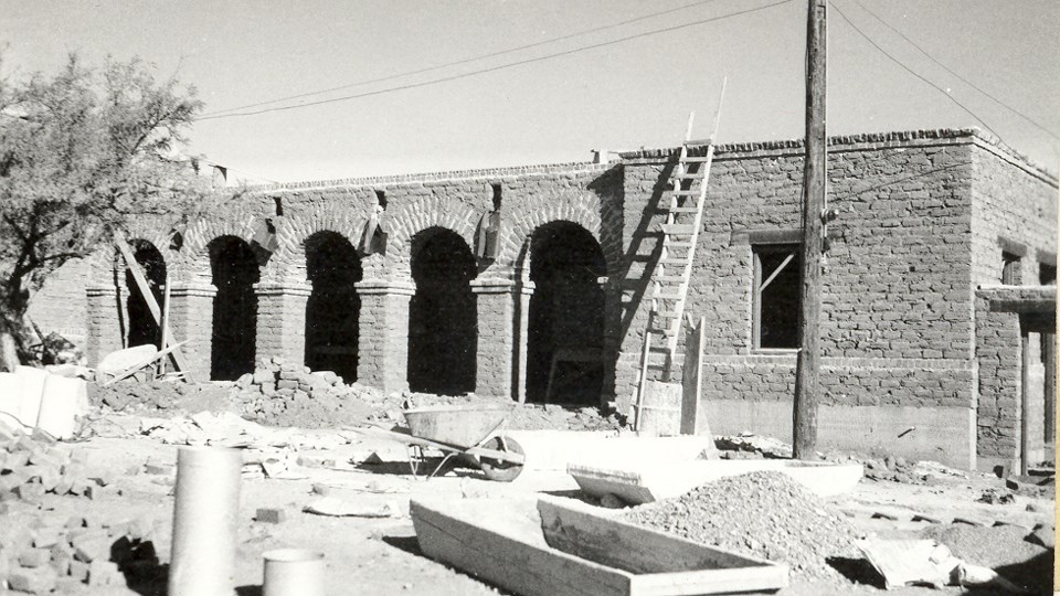 historic photo of arched arcade walkway at visitor center