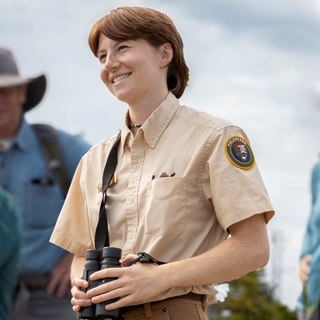 SCA Raptor Intern Sara Holding Binoculars