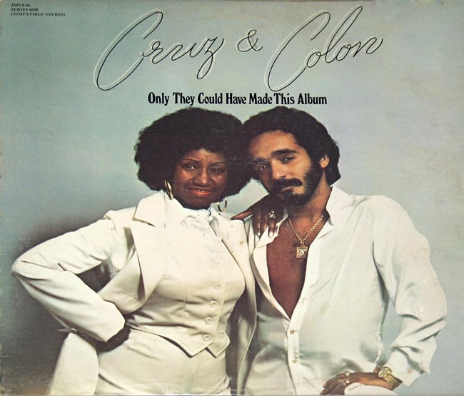 CELIA CRUZ & WILLIE COLON wearing all white posing together