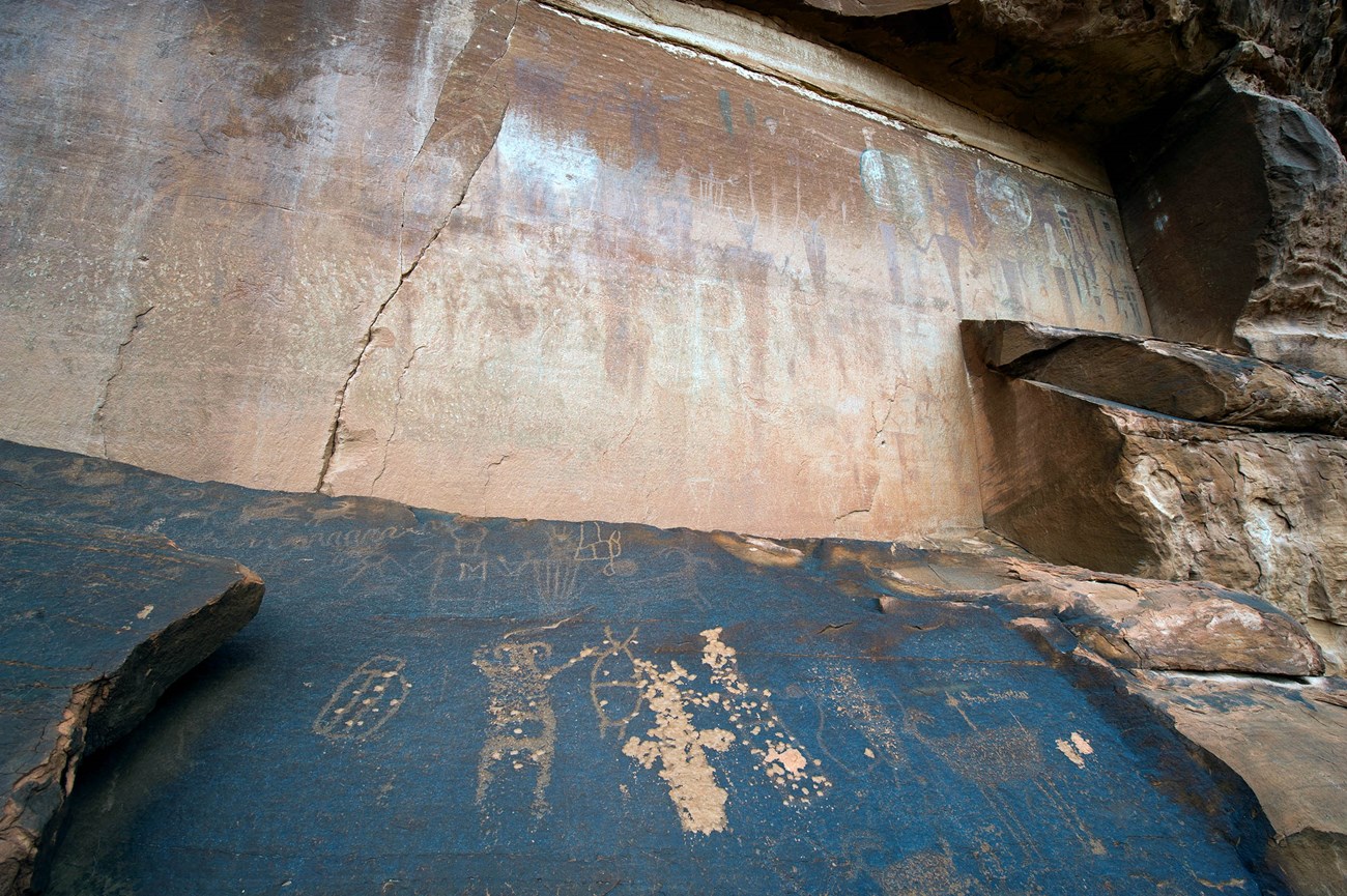 Petroglyphs and Pictographs on large rock panels.