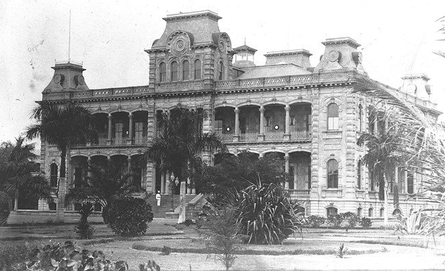 Two story palace with towers in the four corners of the building