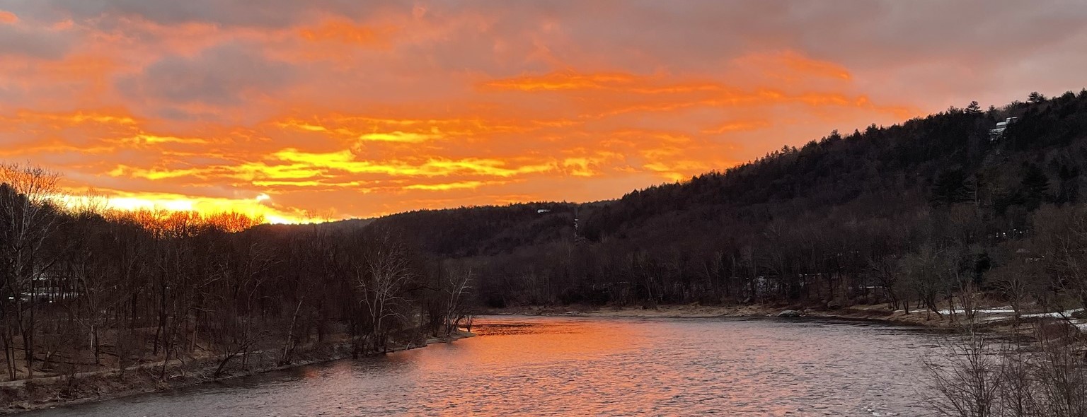 An orange sunset over the Delaware River.