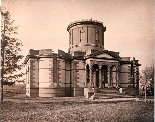 Photograph of the first Dudley Observatory a large building with elevated center column.