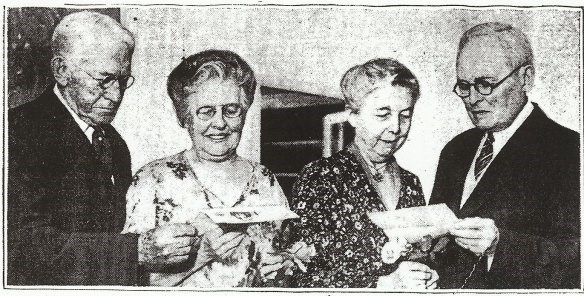 two older couple standing next to each other and looking down at an article about their weddings