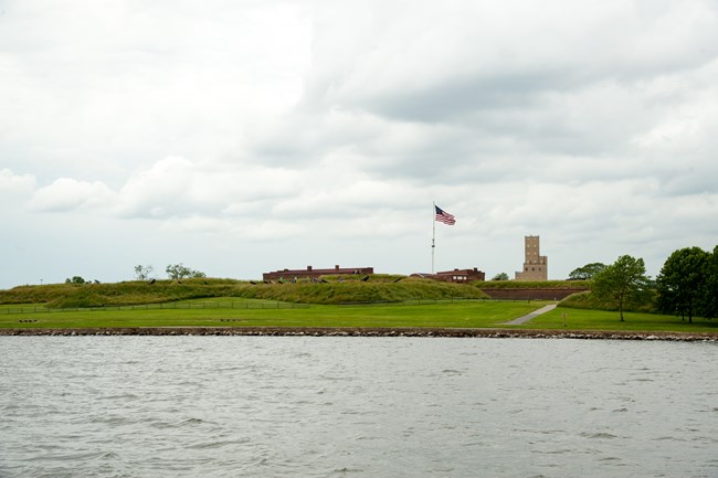Fort McHenry with the flag waving, point of view is from the Patapsco River