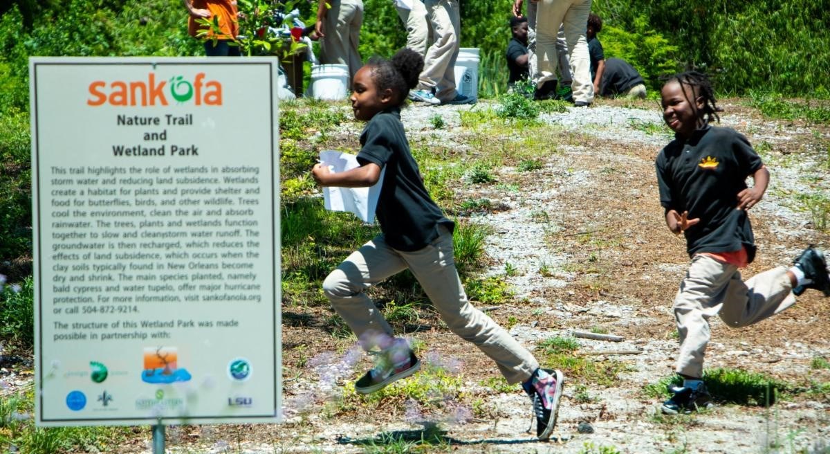 Schoolchildren enjoy outdoor recreation activities at the park.