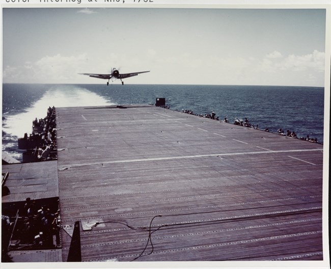 TBM Avenger torpedo plane landing on board the carrier