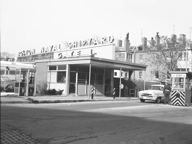 1950s Gate 1 structure. One story square building next to an entrance for cars.