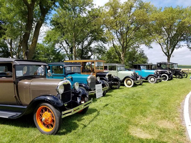 Parked antique cars on display