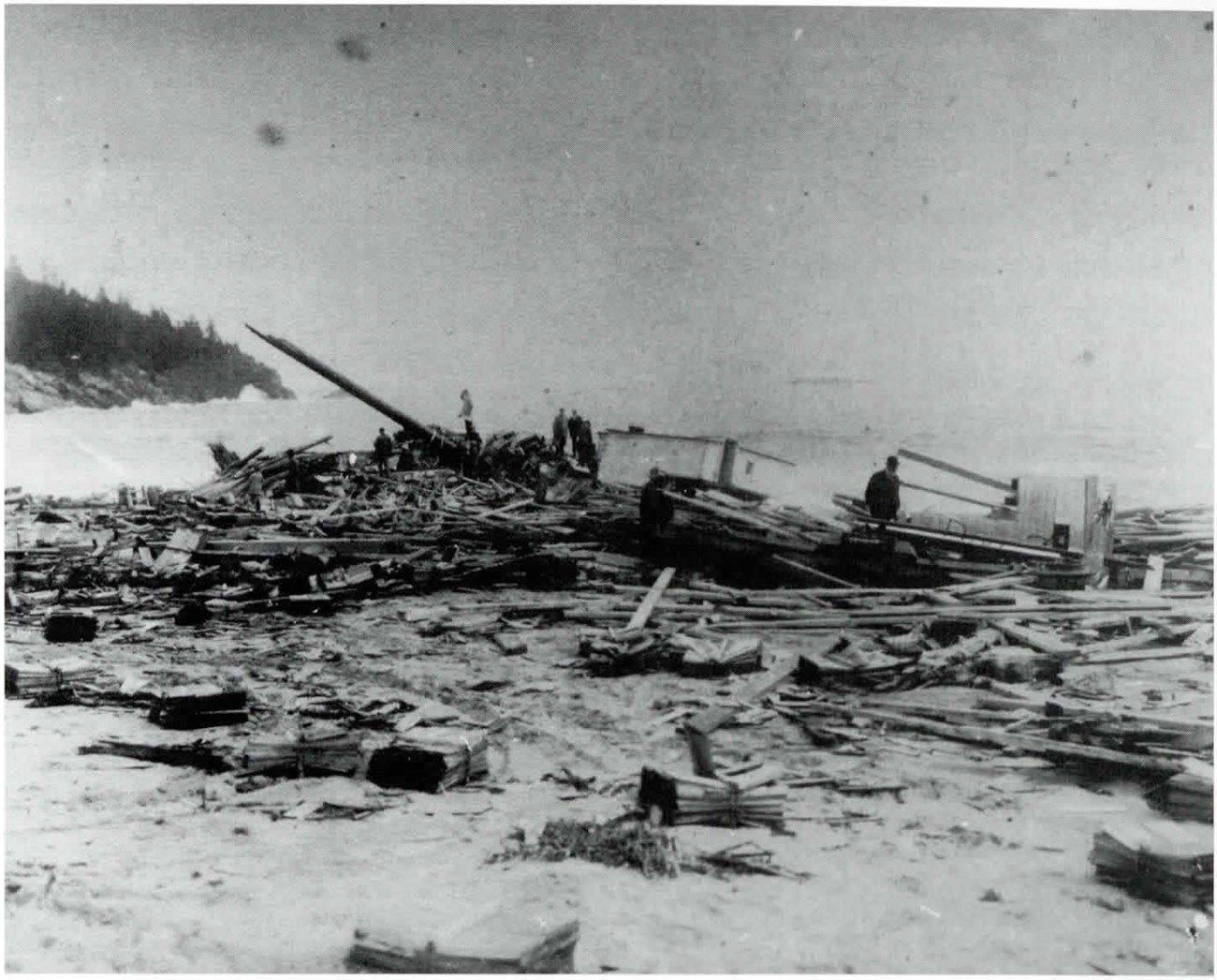 Boards strewn across a beach