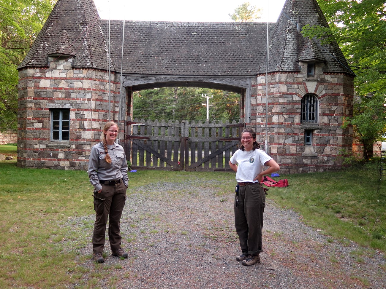 Two women standing in front of bat mist netting at Brown Mountain Gatehouse
