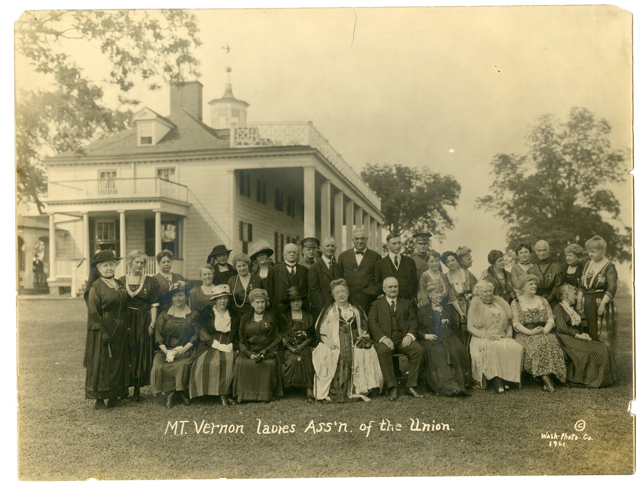 Alice Longfellow poses with 30 other men and women on the lawn of George Washington's home, Mt. Vernon.