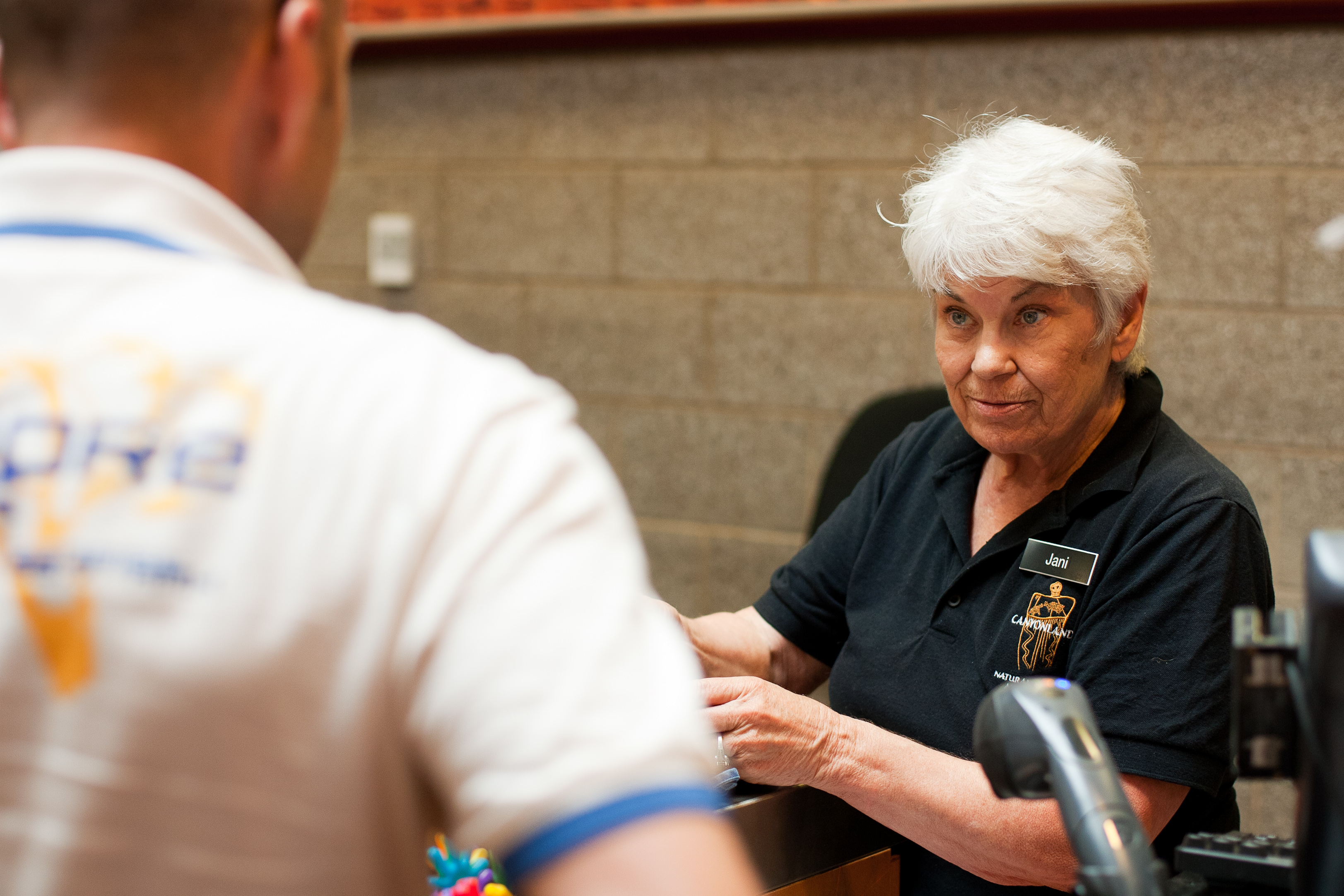 A clerk ringing up a customer at Arches' bookstore