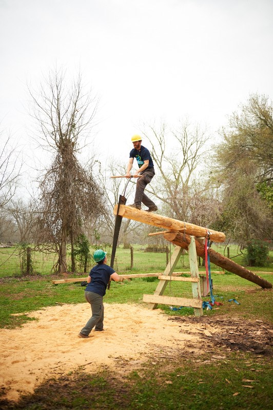 HOPE Crew saws timber for the African House roof structure.