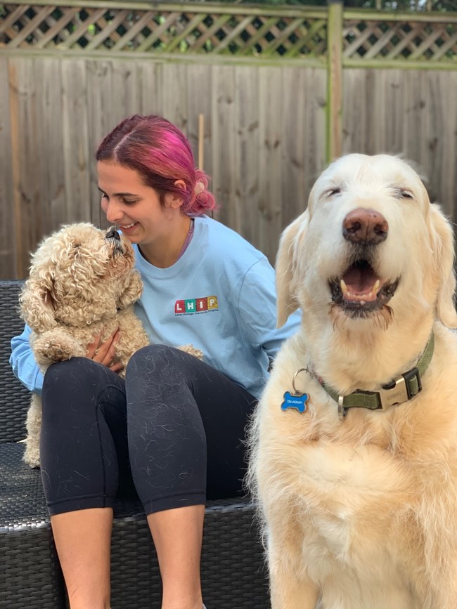 Andrea Miralles-Barboza with two dogs