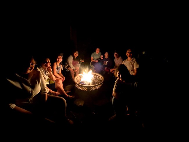 The group around the campfire. A birthday was also celebrated.