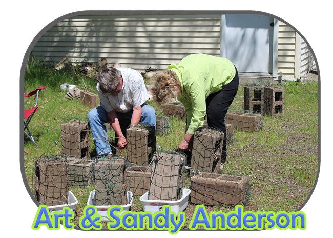 Two volunteers Art and Sandy Anderson building zebra mussel sampler blocks.