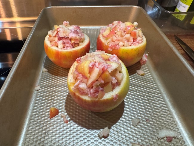 Apple shells filled with a mixture of sausage meat and apple.