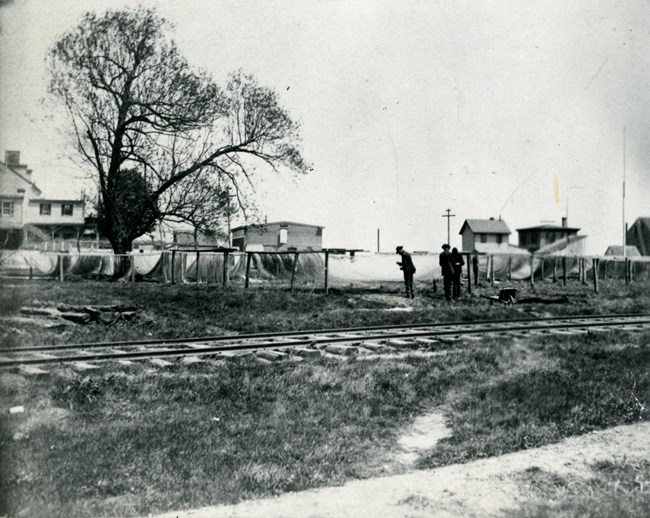 Battery park with train tracks and shad nets.
