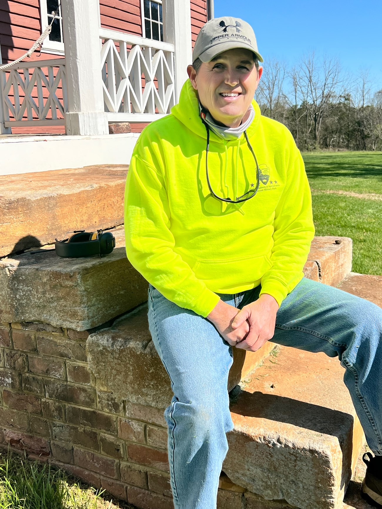 Fredericksburg and Spotsylvania volunteer Bob Gauvin seated on the front steps of the Ellwood house.