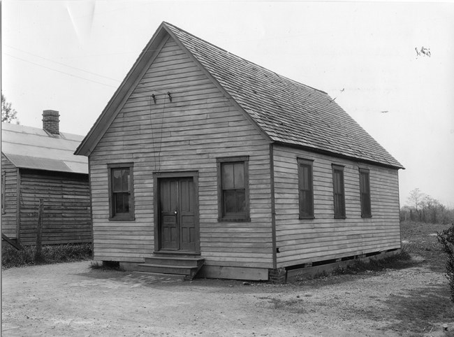 Exterior of a one room school building.