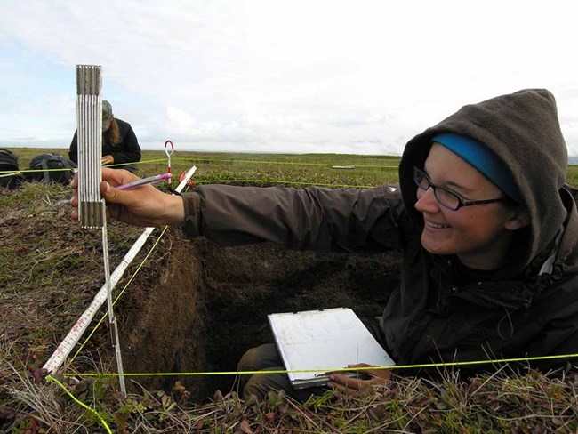 An archaeologist documenting a site.