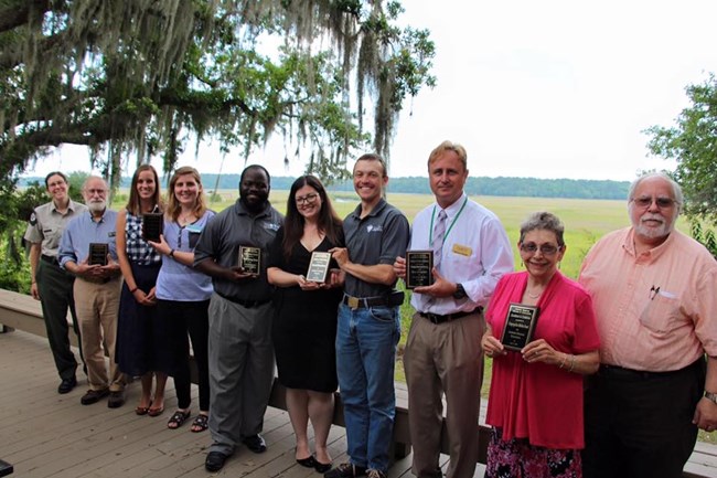 Coastal Museum Association Awards – Coastal Heritage Society received awards for Pinpoint Heritage Museum and Savannah History Museum “Loyalists and Liberty). CHS Staff Ray Christie, Emily Beck, and Aaron Bradford (3 center) are pictured.