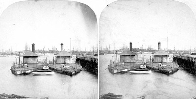Black and white stereograph of two ships in water.