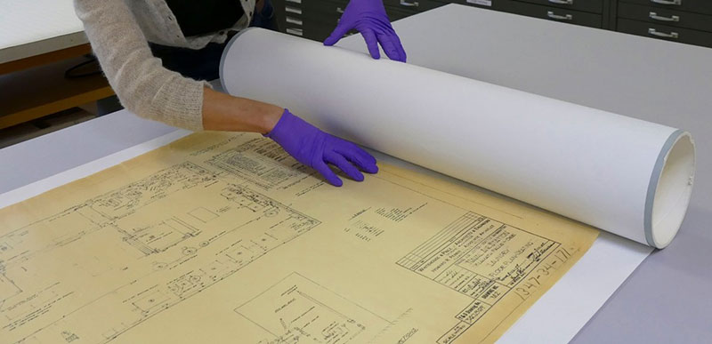 Figure 3. Slowly roll the object and bond paper onto the tube.