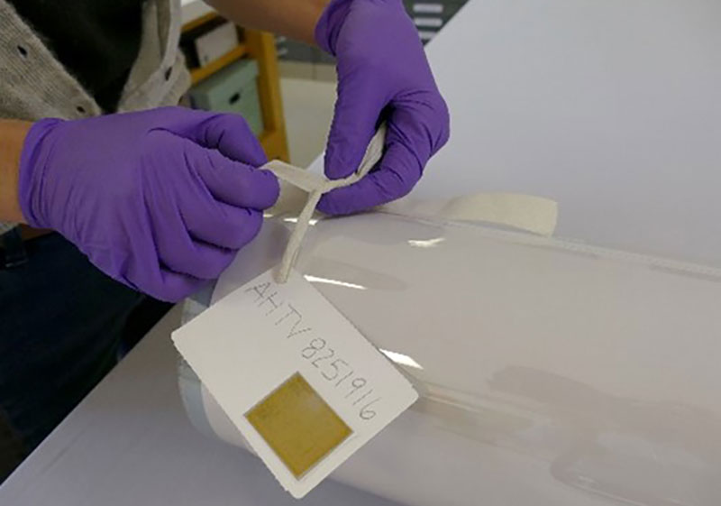 Tie the labeled twill tape around the tube.