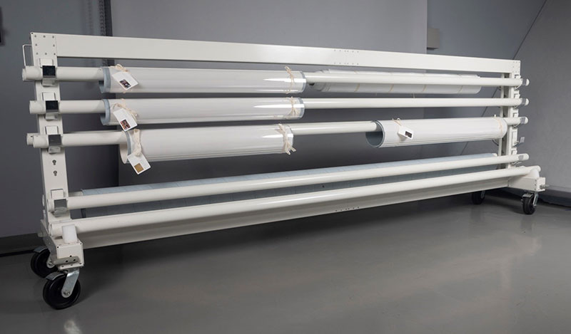 Completed rolls hanging on a rolled storage system.