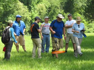 A group of people operating equipment.