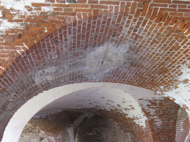 Water Damaged masonry in brick archway