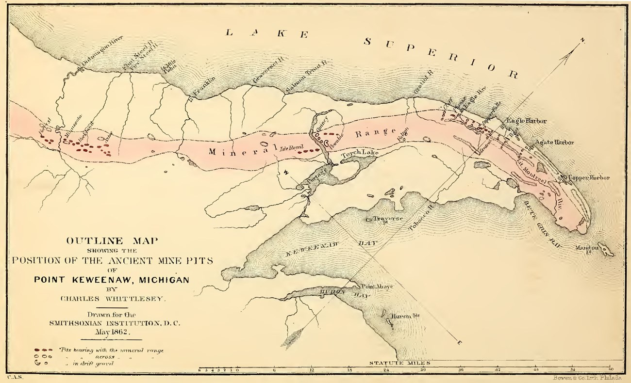 Drawing of Keweenaw Peninsula highlighting the mineral range and the positions of the indigenous pits along it. A red band highlights the mineral range along the spine of the Keweenaw, with red dots indicating the indigenous pits within it.