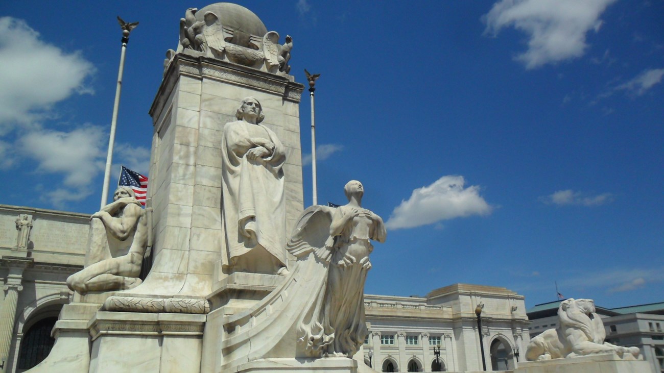White marble fountain with figure of Christopher Columbus in front of Union Station