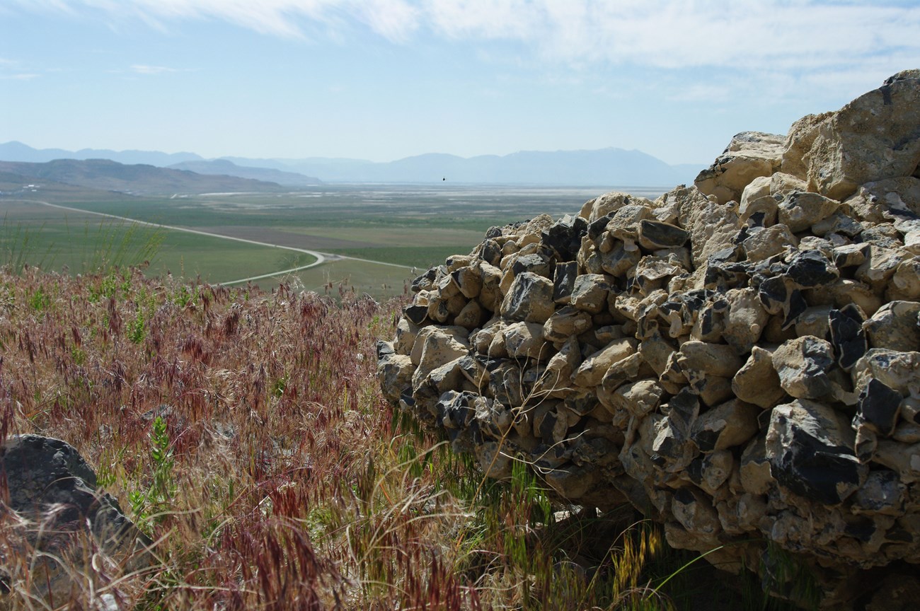 Conglomerate rock overlooking fields at Golden Spike National Historic Site. NPS photo.