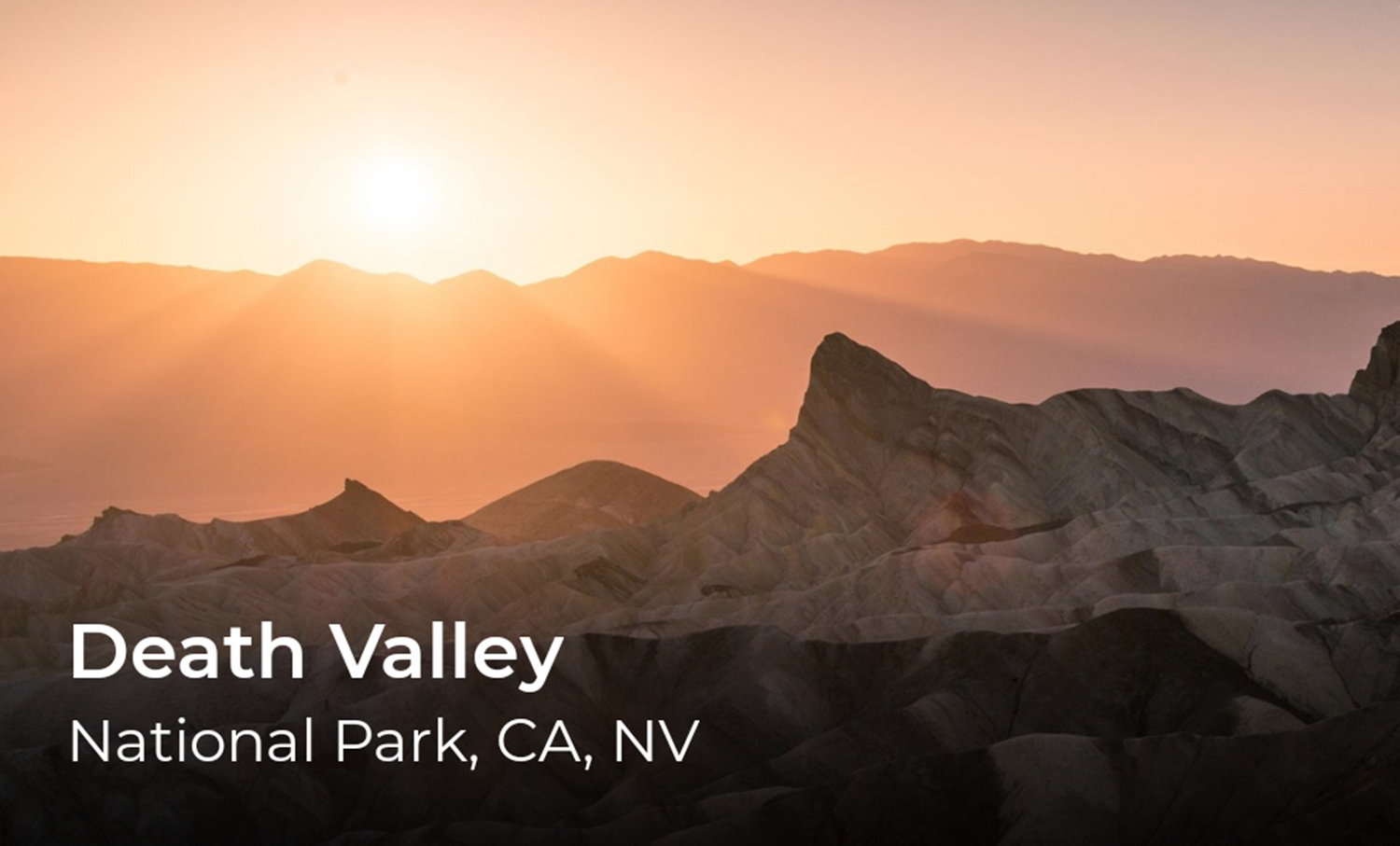 A sunset over a desert mountain landscape, words in the lower left read, Death Valley.