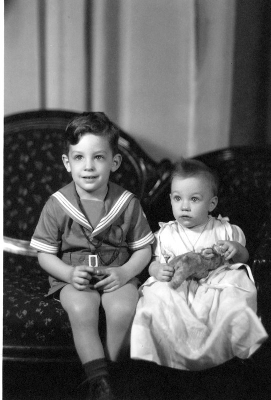 Portrait of young David and Marian Wallace on a couch