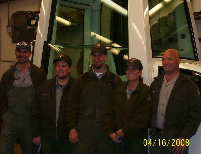 NPS employees pose with Popemobile