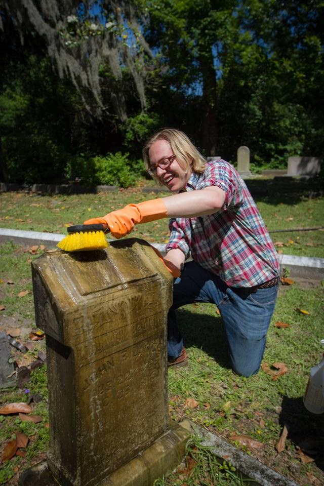 Derek Llamas (BFA, Historic Preservation 2016) cleans a grave marker in Laurel Grove Cemetery North during Preservation Week 2015.